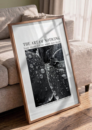 after the rain II by hazelart in a walnut frame leaning against a grey sofa