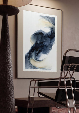 Frozen Light by Anna Dormir framed in a dim room beside a tubular steel chair