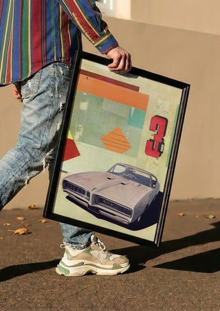 GTO 3 by Kareem Rizk carried in a black frame along a sunny street