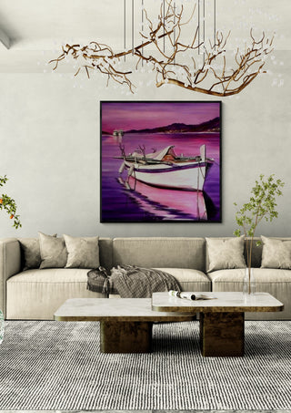 Boat in Pink by Sunny in a black frame above a beige sofa under a branch chandelier
