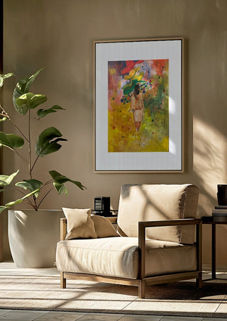 The weight of the world full colour by Madame Petit framed above a beige armchair beside a potted plant