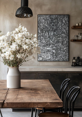 Resized Imagination by Priit Ruttas in a black frame above a rustic table with white flowers