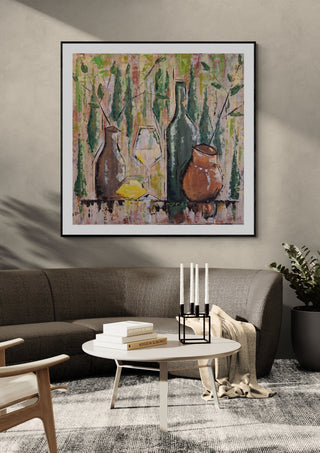 Summer mood by Dina in a black frame above a dark grey sofa with a round table and candlesticks