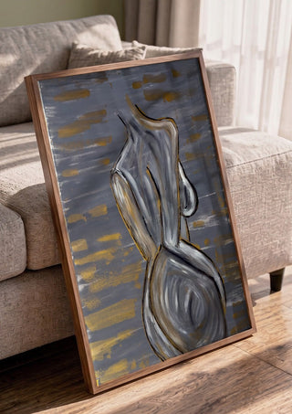 Contours of Silence by Bibi in a walnut frame leaning against a grey sofa