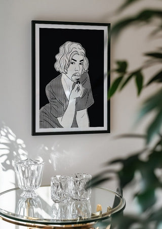 Poppy by Nari in a black frame above a glass table with crystal glassware