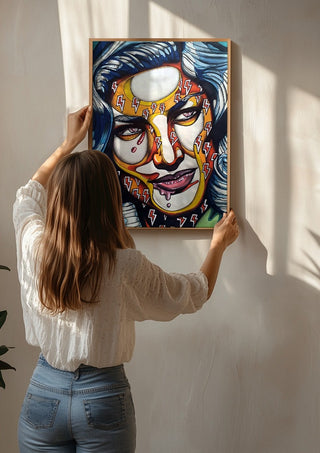 Lauren Bacall by Okiana being hung on a sunlit wall
