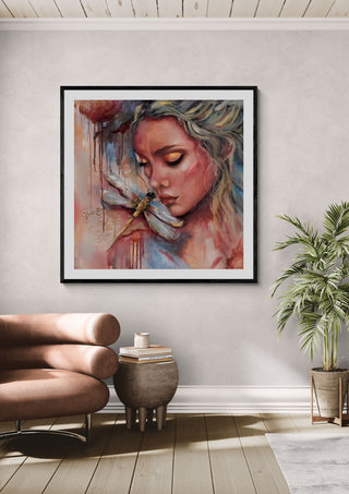 Inner Reflection by Elisa Kay framed above a tan armchair beside a potted plant