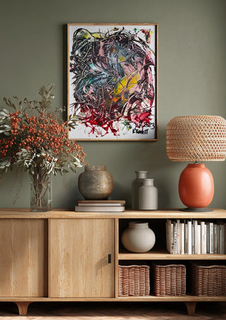 Tangle by Ronald Rumell above a wooden sideboard on a sage green wall