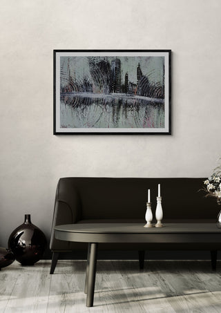 City Reflections by luco art in a black frame above a dark sofa with white candlesticks
