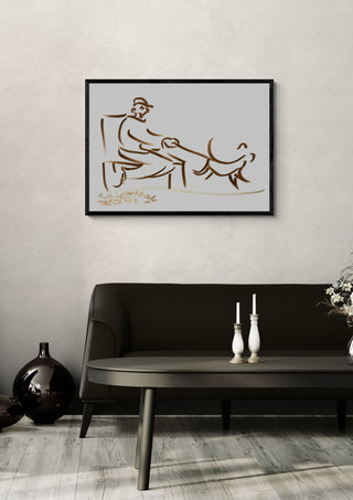 Man and Dog by Eva Hartman in a black frame above a dark sofa with white candlesticks