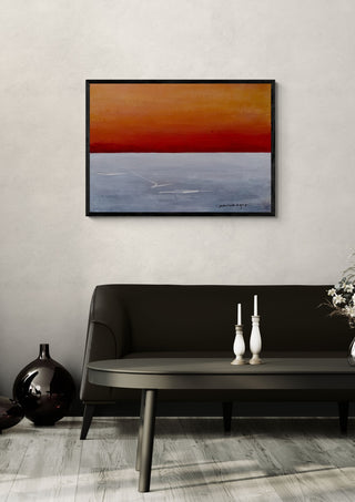 Golden Glow by Marina Agre in a black frame above a dark sofa with white candlesticks