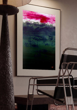 Emerald and Carmine by Marina Agre framed in a dim room beside a tubular steel chair