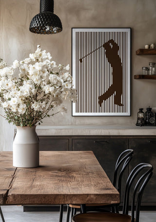 golf sport silhouette by nyai in a black frame above a rustic table with white flowers