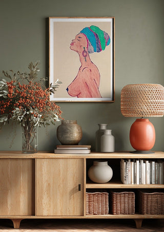 Melanin & Moonlight by Bibi above a wooden sideboard on a sage green wall