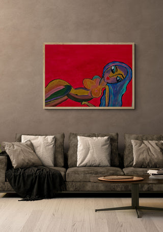Crimson Reverie by Bibi in an oak frame above a grey sofa with cushions