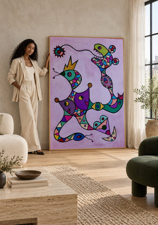 Crowned Creatures by Steffi Seiler leaning against a sunlit living room wall beside a woman
