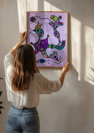 Crowned Creatures by Steffi Seiler being hung on a sunlit wall