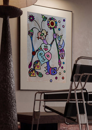 Hearts and Sunflower by Steffi Seiler framed in a dim room beside a tubular steel chair
