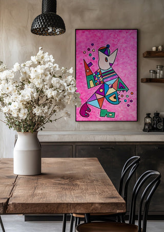 Pink Cat by Steffi Seiler in a black frame above a rustic table with white flowers