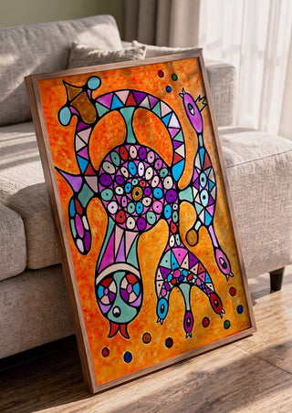 Circle of Eyes by Steffi Seiler in a walnut frame leaning against a grey sofa