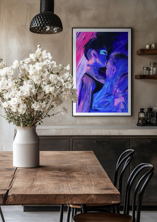 Embrace by Vanyay in a black frame above a rustic table with white flowers