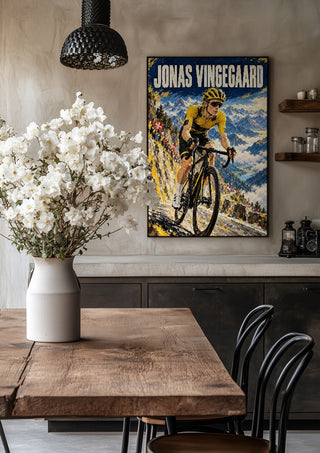 Jonas Vingegaard by Danii Steinfeldt in a black frame above a rustic table with white flowers