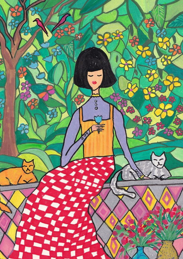 The Garden Wall by Camilla Nilsson - a woman with two cats on a tiled wall in a flowering garden