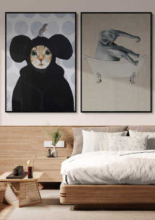 Framed art of an elephant relaxing in a bathtub, displayed above a modern bed in a stylish bedroom.
