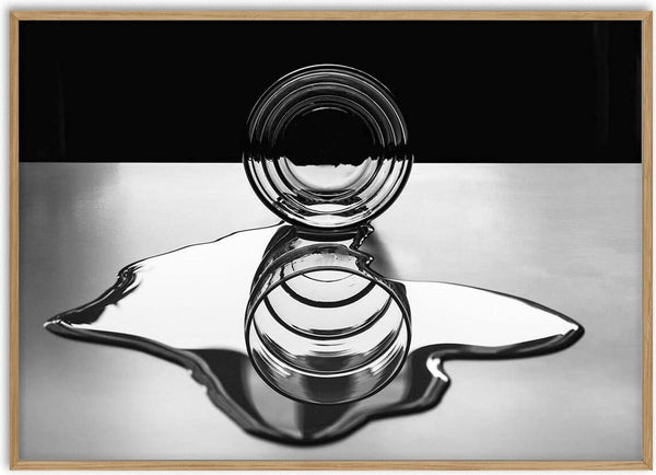 Glass circle with concentric rings reflecting on a liquid surface, artwork from Circles of circles by Giorgio Toniolo.