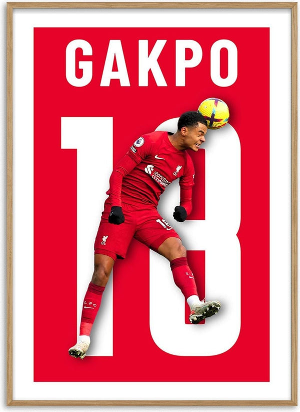Poster of Cody Gakpo in a Liverpool kit heading a ball, with his name and number 18 on a red background.