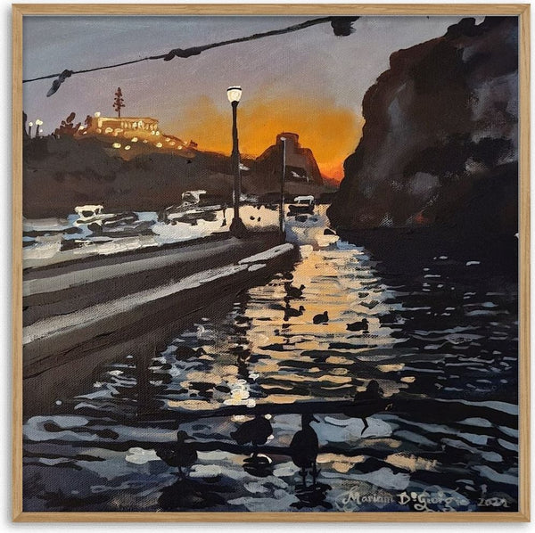 Dusk in Xlendi by Mariam De Giorgio - an orange sunset behind a dark headland over a gold-streaked harbour