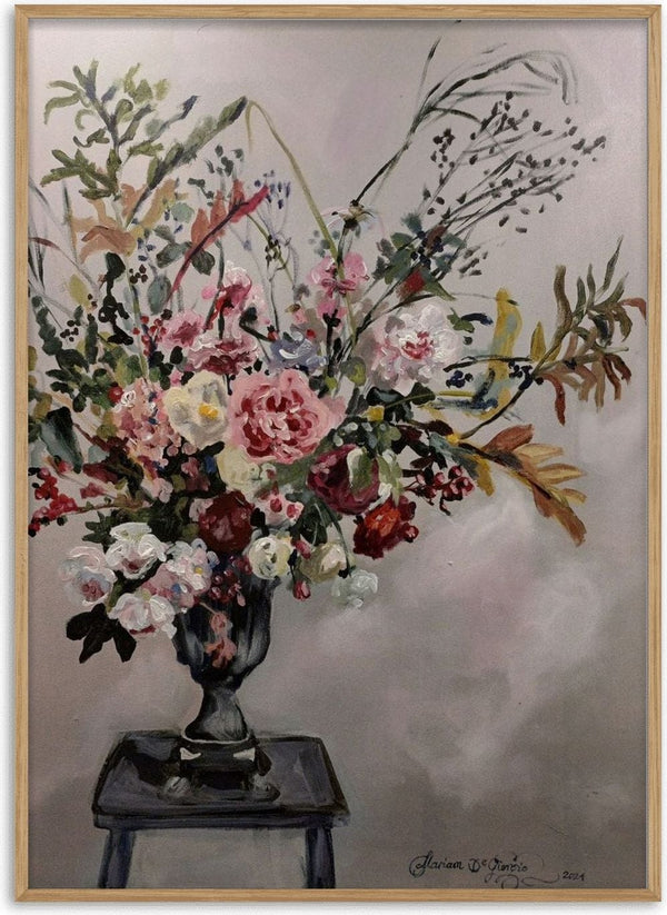Floral arrangement on Grandmother's stool by Mariam De Giorgio - tall bouquet of pink roses and grasses in a grey urn on a stool