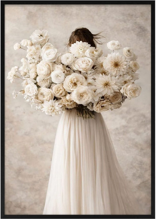 Woman in a flowing dress holding large bouquet of white flowers, Floralia by Annika Persson.