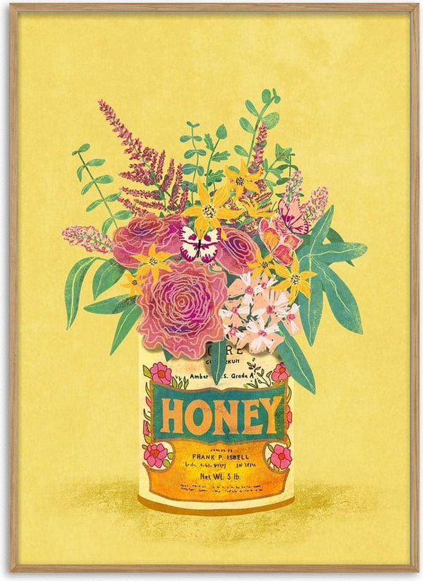 Assorted colorful flowers arranged in a vintage honey can labeled "HONEY" on a yellow background.