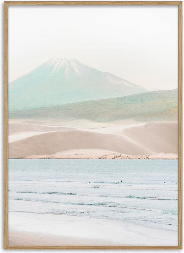 Minimalist print of a serene beach with gentle waves and a misty mountain in the background.