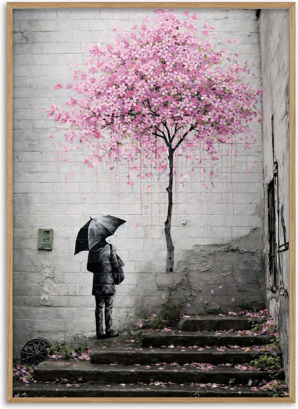 Spring x Banksy by Decker Studios - figure with an umbrella beneath a pink blossom tree on a brick wall
